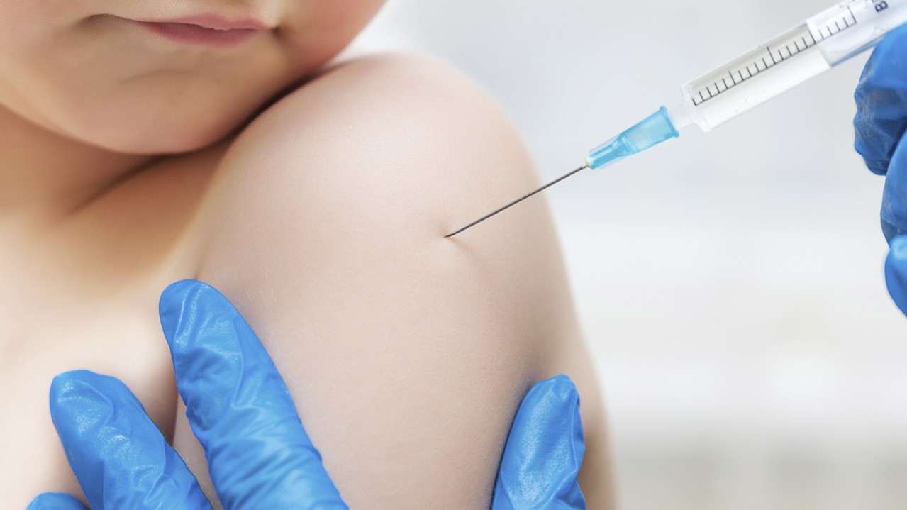 Child getting vaccine jab