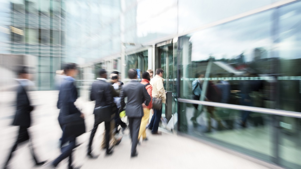 Business people entering office building