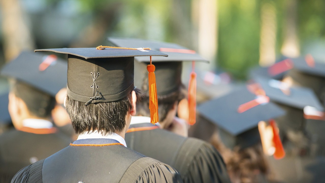 back of graduates during commencement
