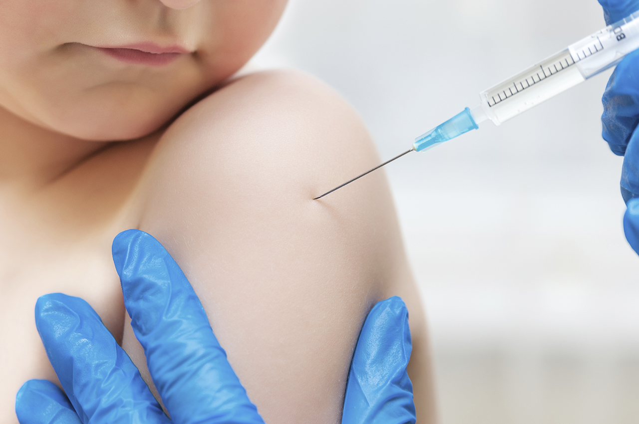 Child getting vaccine jab