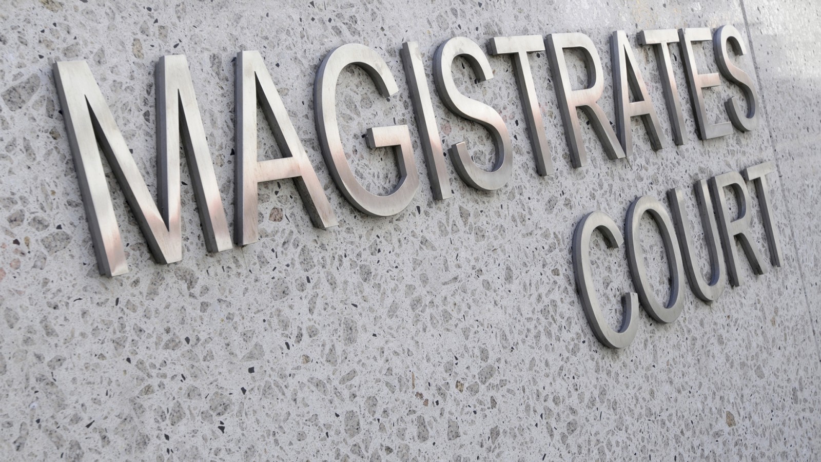 Magistrates Court sign in stainless steel