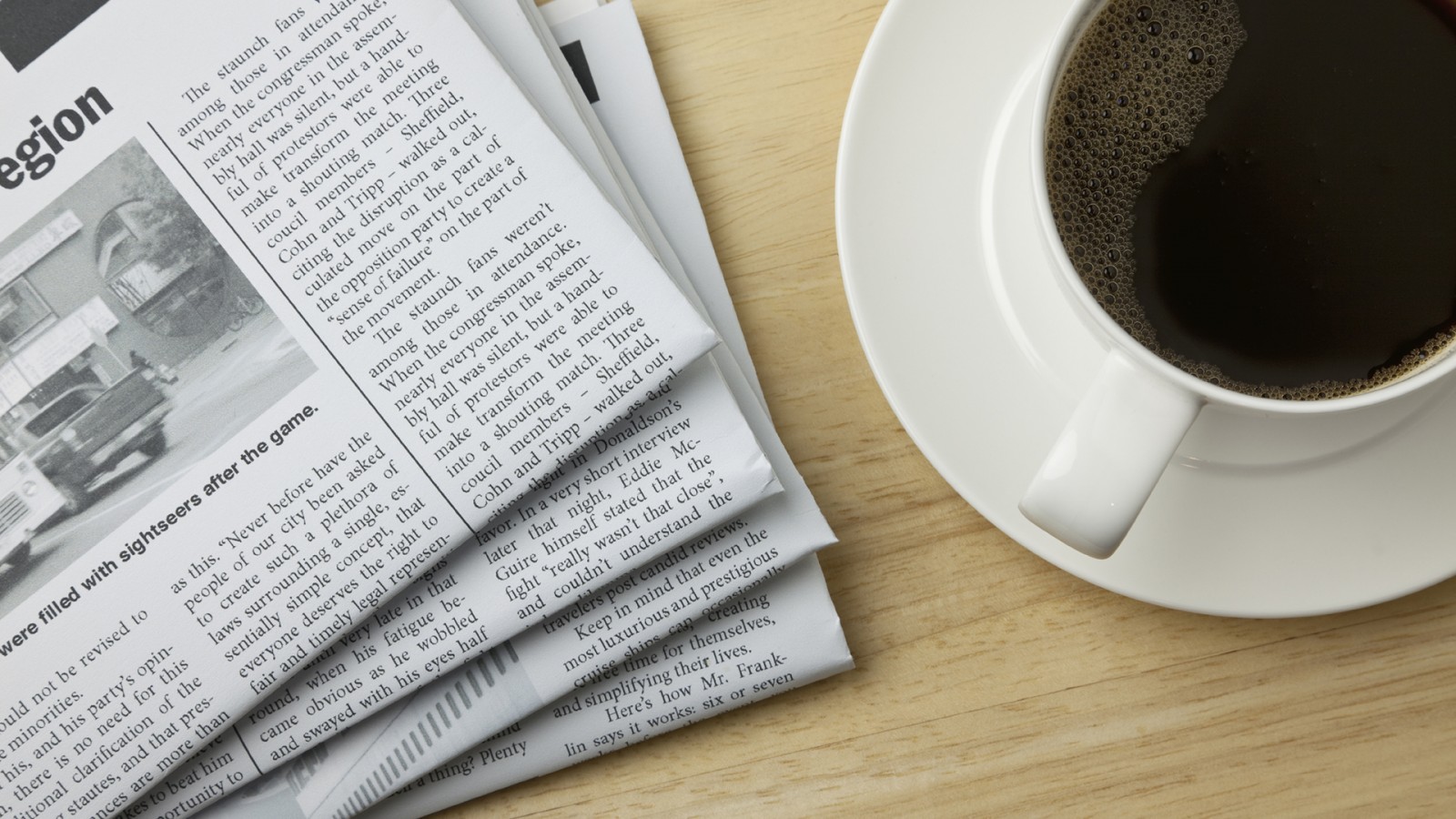 Newspaper with coffee