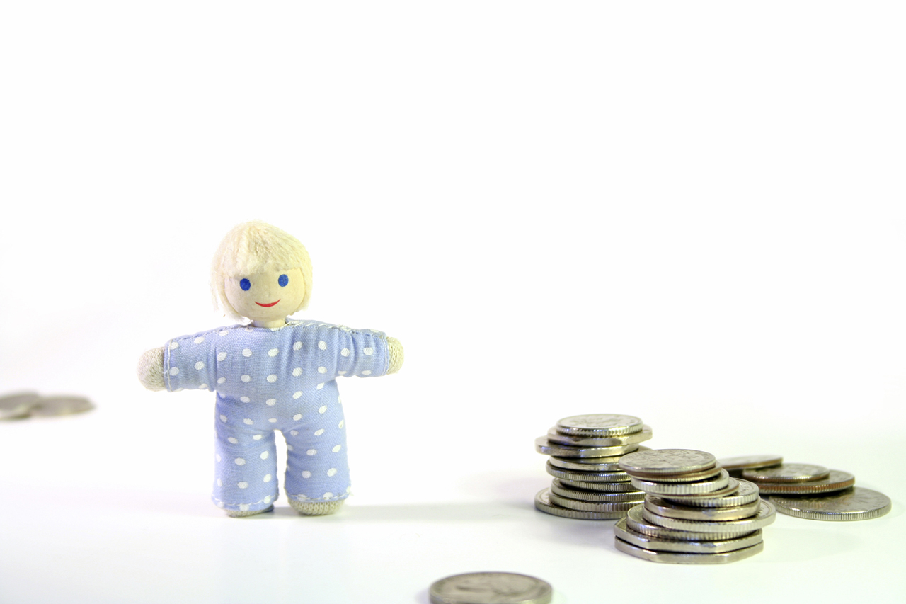 Soft doll with coins